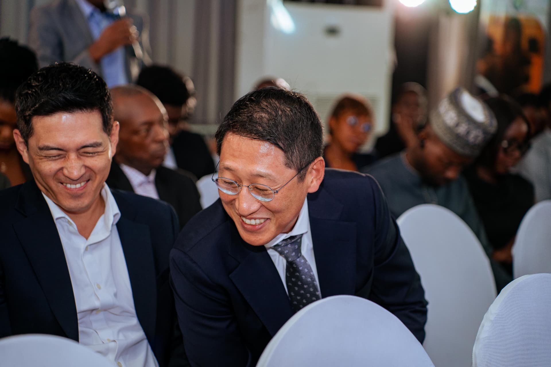 Guests sharing a candid moment during a programme