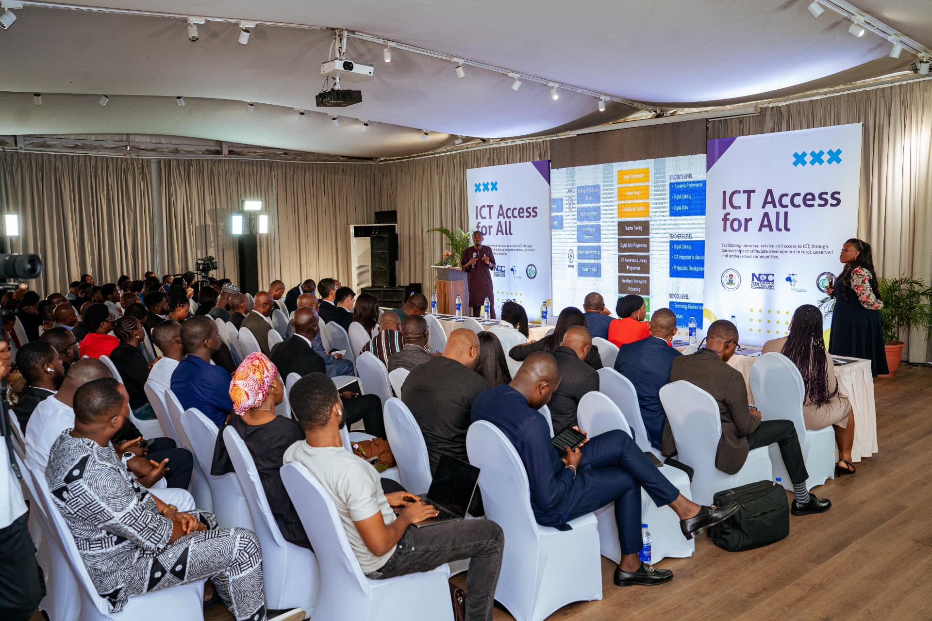 Audience and speaker at the ICT Access for All forum